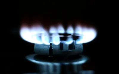 Blue gas burner flame on a cooktop